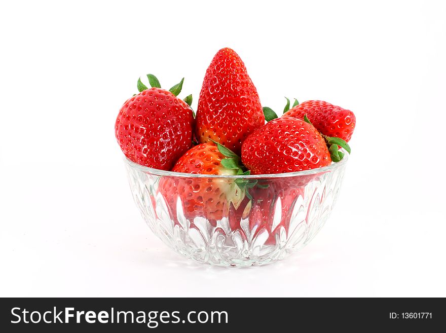 Fresh ripe strawberry in a glass bowl isolated on white background. Fresh ripe strawberry in a glass bowl isolated on white background