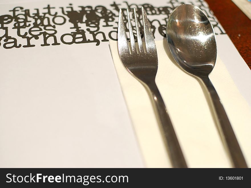 Table layout in a restaurant or hotel with kitchen utensils. Table layout in a restaurant or hotel with kitchen utensils.