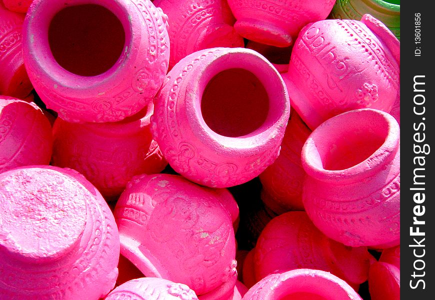 Pink colored clay pots for sale in the market
