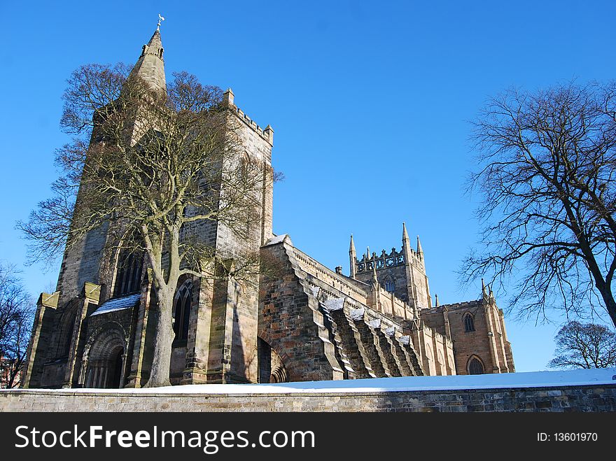 Dunfermline abbey in winter looking majestic compared to the leafless trees around it. Dunfermline abbey in winter looking majestic compared to the leafless trees around it