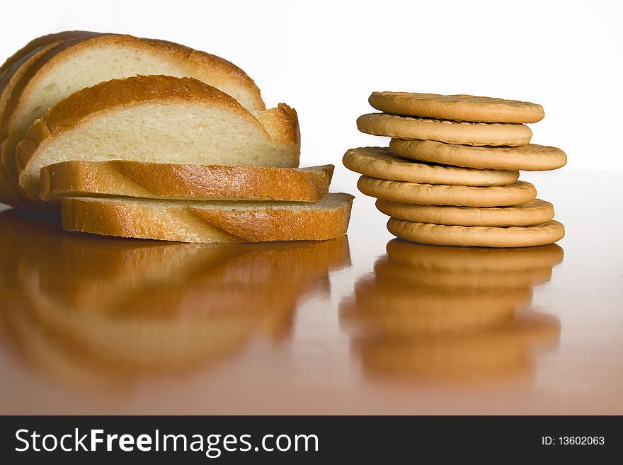 Slice bread and cookies on cook-table. Slice bread and cookies on cook-table