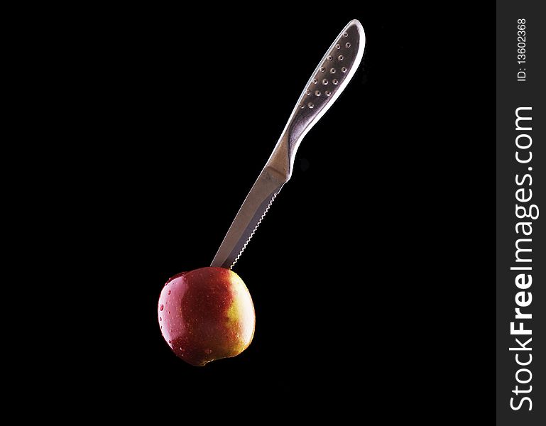 Cutting into an Apple before eating it. Cutting into an Apple before eating it.