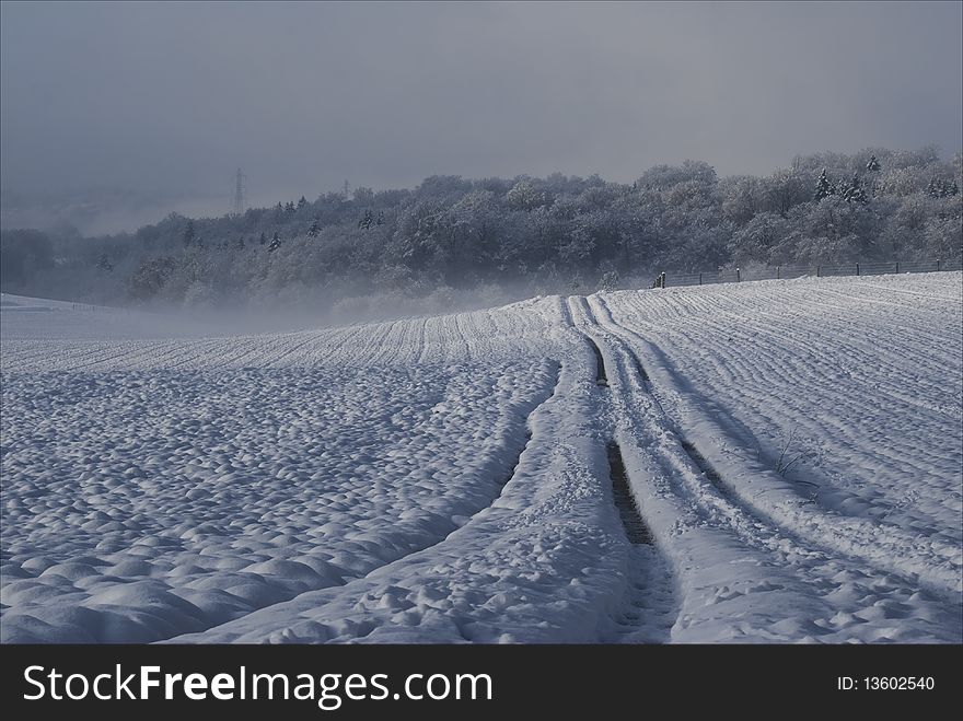 Surreal snow landscape with a road