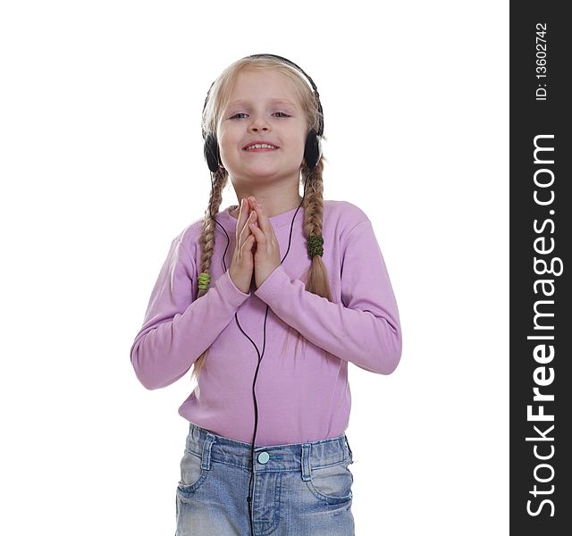 The smile little girl in headphones. Isolated on a white background