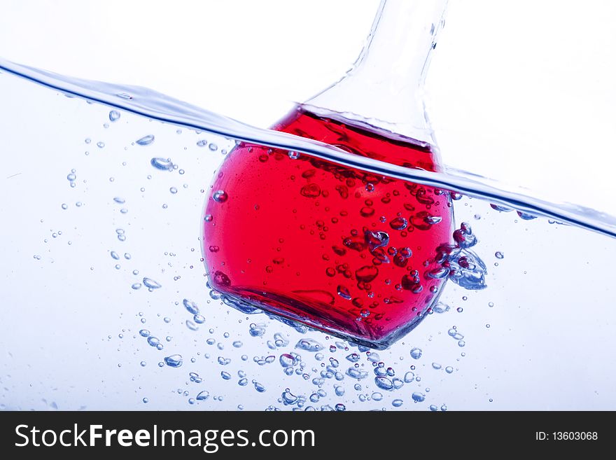 Underwater flask shot in blue background. Underwater flask shot in blue background