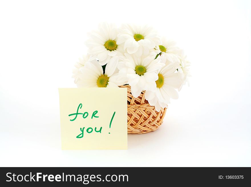An image of basket with white daisies with inscription (for you). An image of basket with white daisies with inscription (for you)