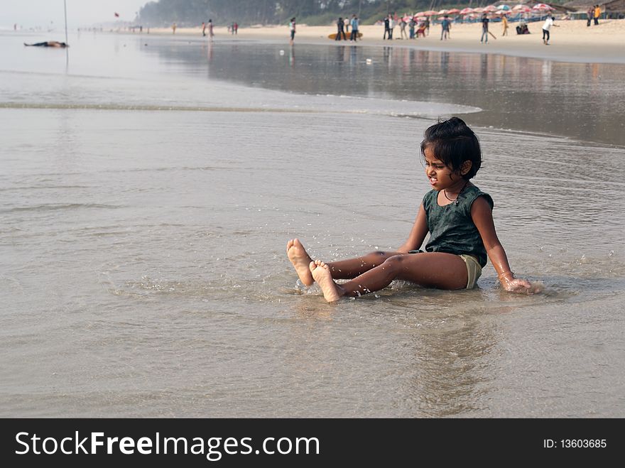 Happy indian girl play games on seacosts. Happy indian girl play games on seacosts