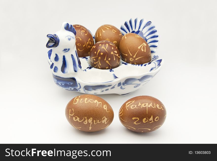 Easter greetings on decorated eggs in porcelain tray