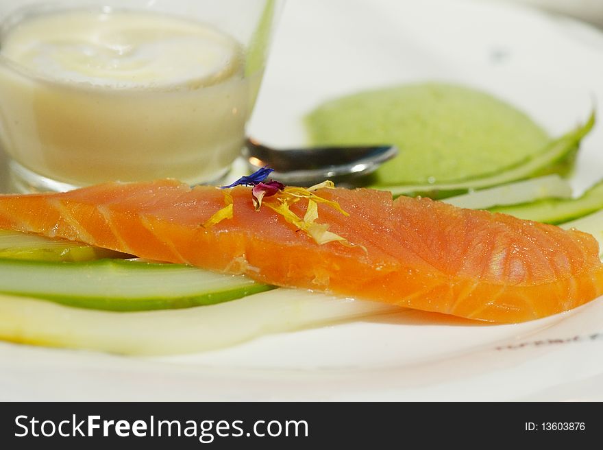 A slice of fresh salmon with green asparagus