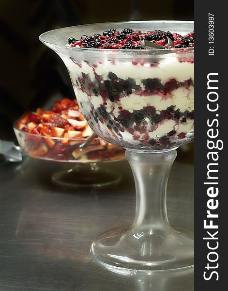 Fresh red blackberries and raspberries in a bowl with cream. Fresh red blackberries and raspberries in a bowl with cream