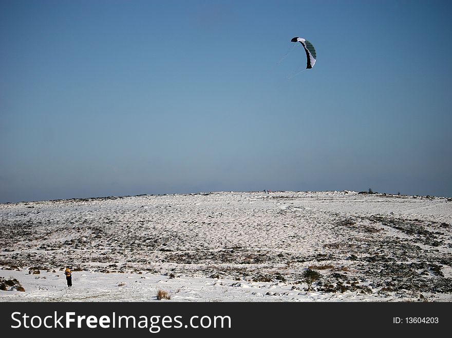 Man kite skiing on Dartmoor. Man kite skiing on Dartmoor