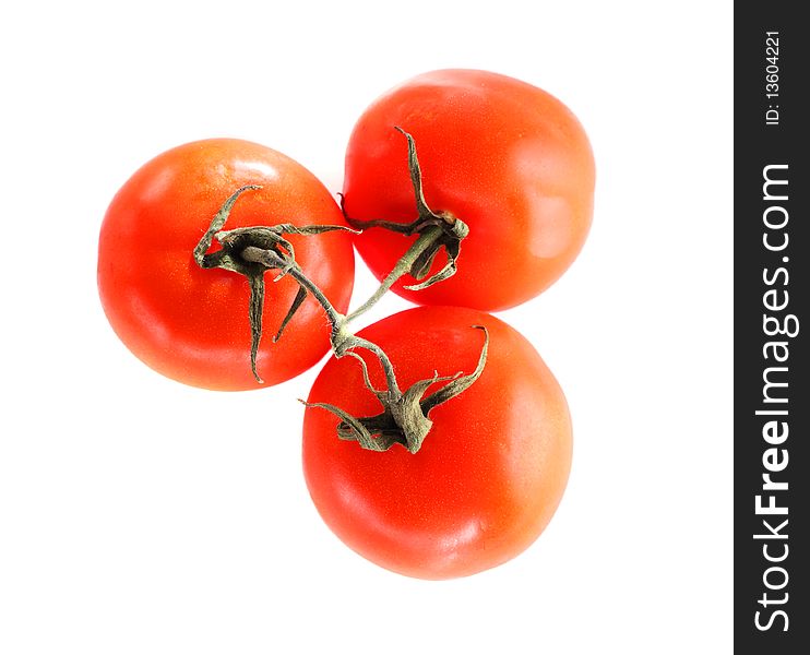 Three ripe tomatoes isolated on the white. Three ripe tomatoes isolated on the white