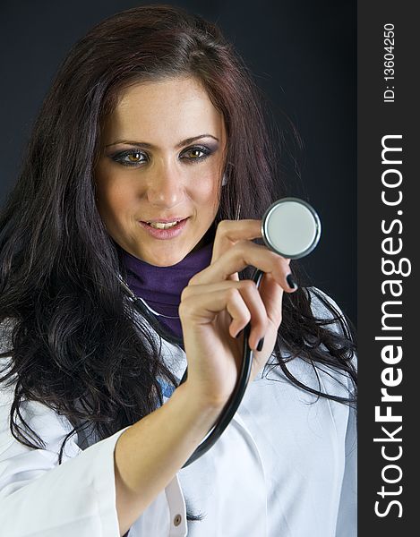 Cute female doctor holding a stethoscope