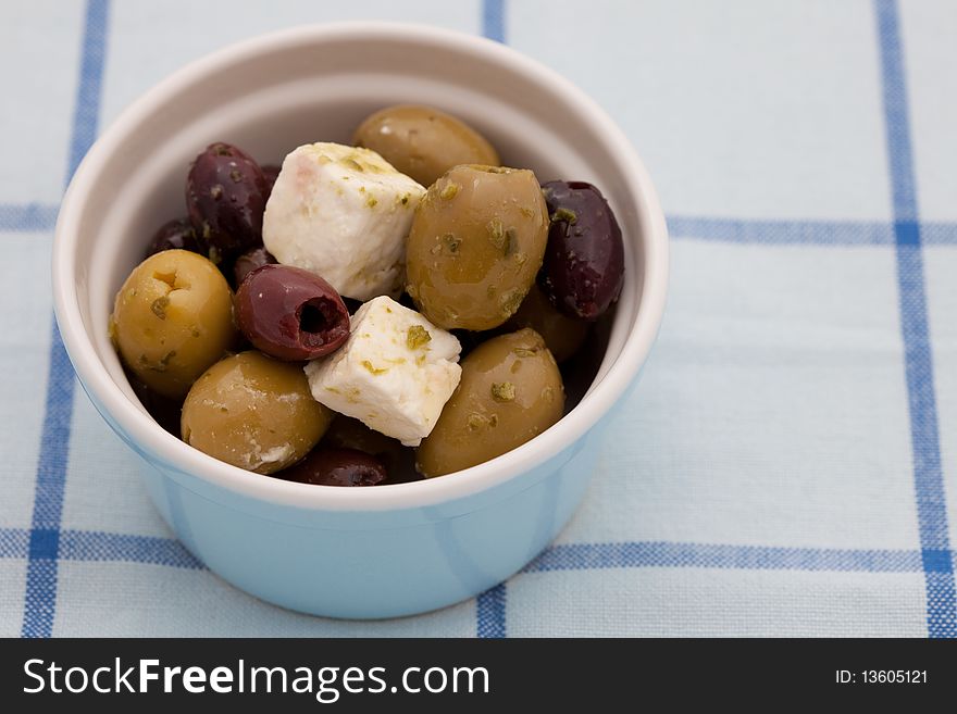 Fresh kalamata and green olives in a small bowl