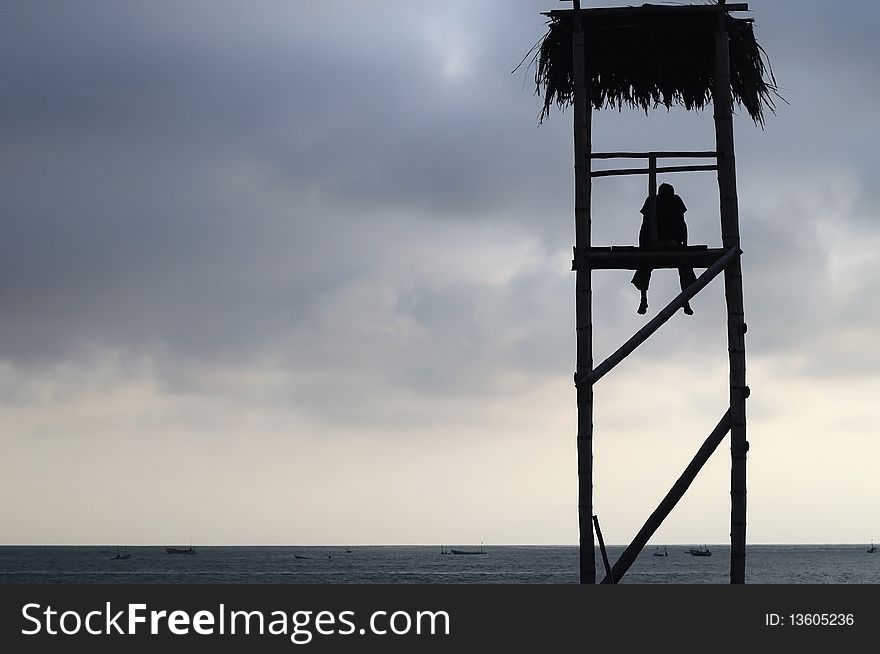 Tired Lifeguard in a watchtower