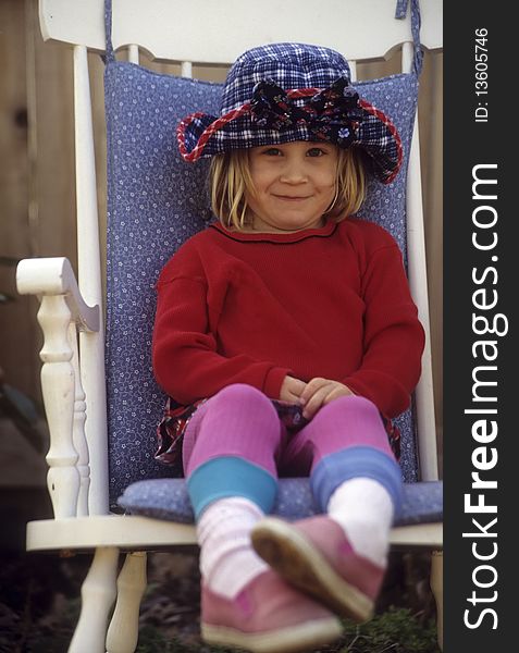 Cute young girl in a chair