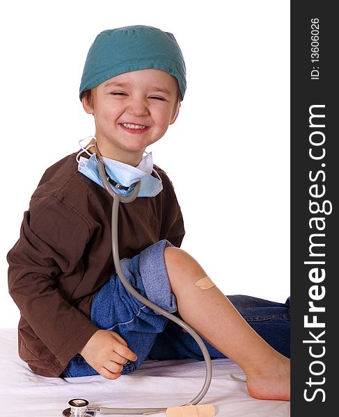 Smiling Caucasian boy playing doctor. Smiling Caucasian boy playing doctor