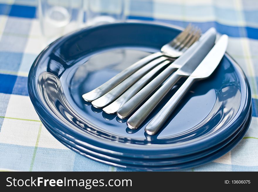 Stack of blue dishware and tableware