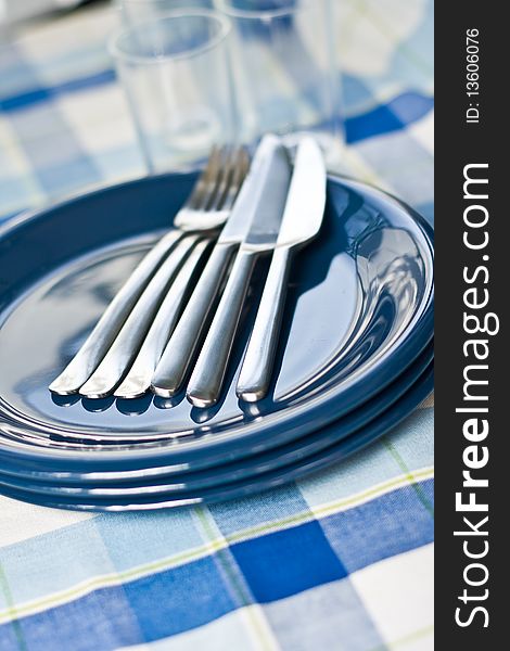 Stack of blue dishware and tableware