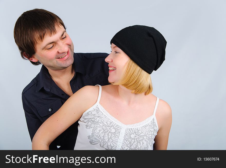 Portrait happy young couple in studio