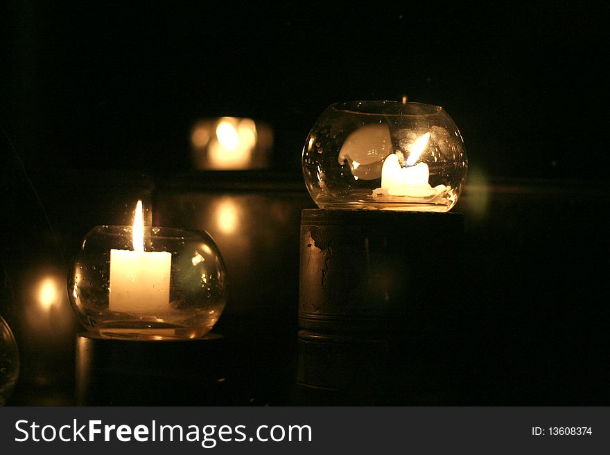 Candles in a glace can