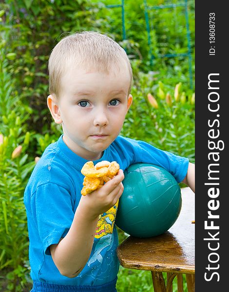 Boy with mushrooms outdoors in the summer