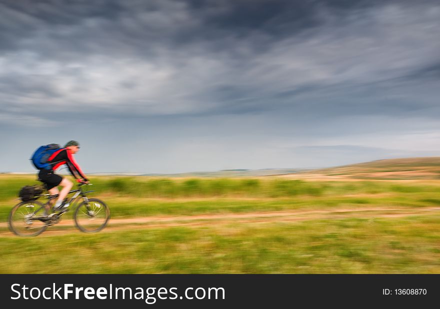 Man relax biking in motion. Man relax biking in motion