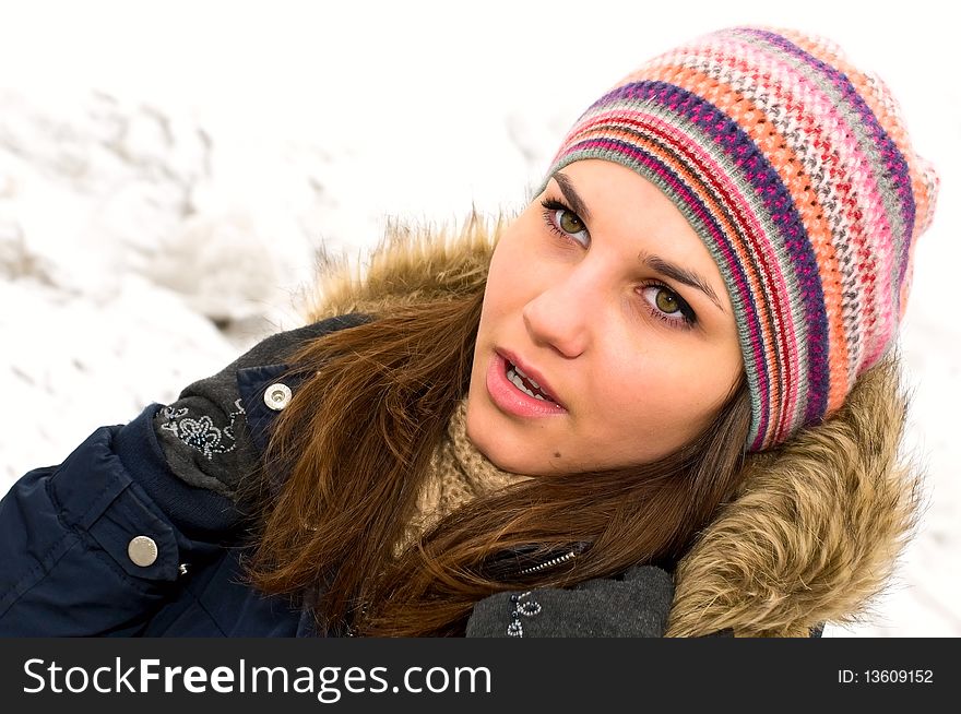 Portrait of young woman in colored cap. Portrait of young woman in colored cap