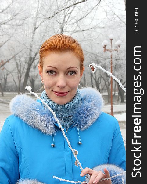 The red-haired girl against the frozen park. The red-haired girl against the frozen park