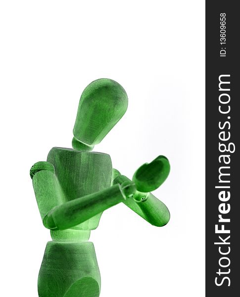 A green wooden manikin on white background