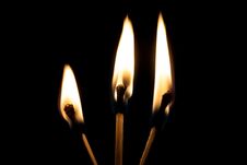 Three Burning Matches In The Dark Close Up Stock Photo