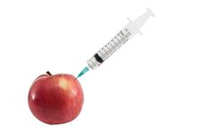Apple And Syringe. Stock Photography