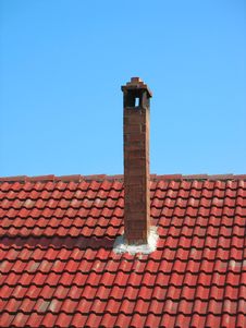 Red Brick Chimney On Tile Roof Over Blue Sky Royalty Free Stock Photography Red Brick Chimney On Tile Roof Over Blue Sky Royalty Free Stock Photography