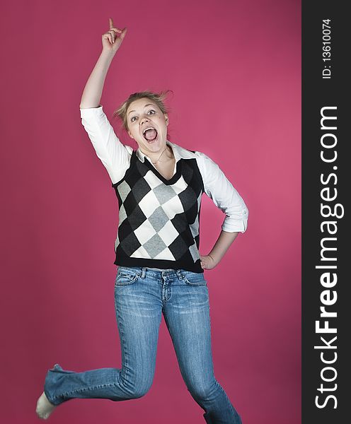 Woman with blond long hair and happy smiling facial expression jumping up. Woman with blond long hair and happy smiling facial expression jumping up