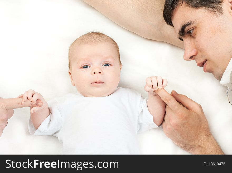Happy family home: father playing with his little baby. Happy family home: father playing with his little baby