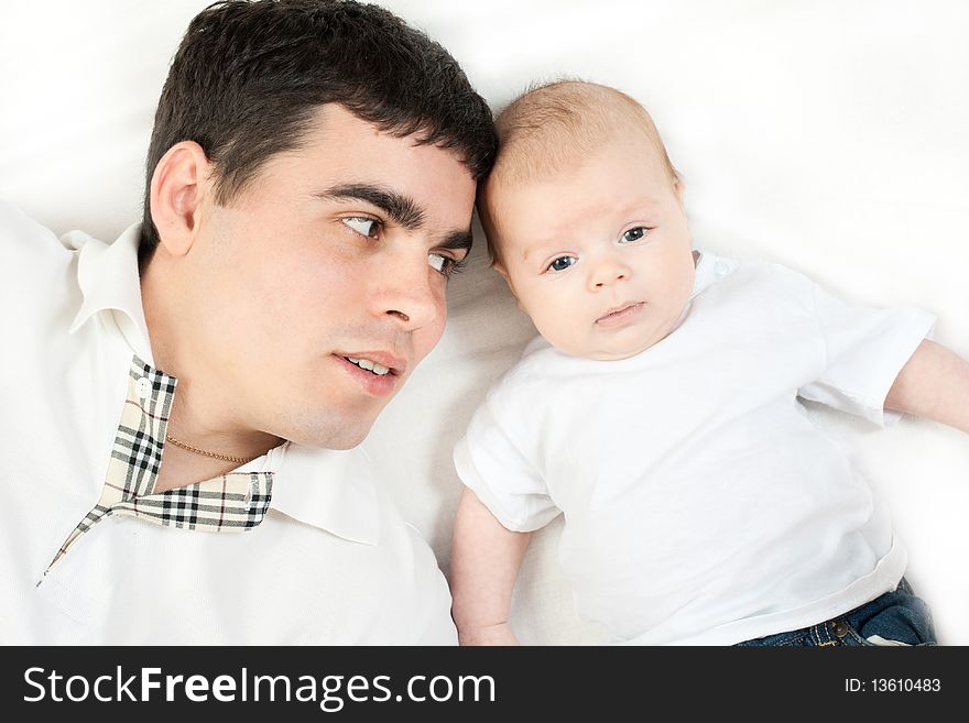 Happy family home: father playing with his little baby. Happy family home: father playing with his little baby