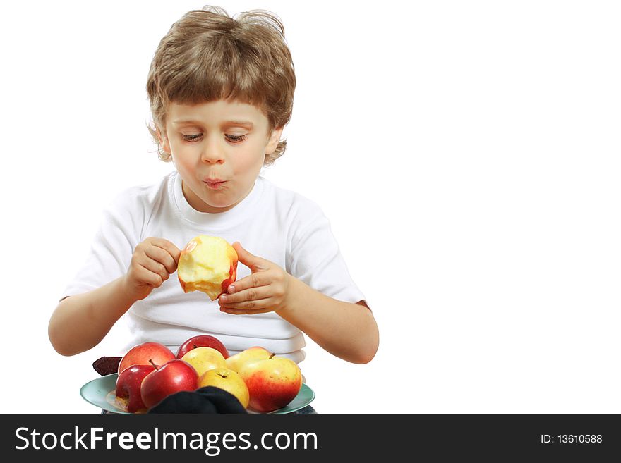 Little beautiful child playing and eating an apple - isolated on white. Little beautiful child playing and eating an apple - isolated on white