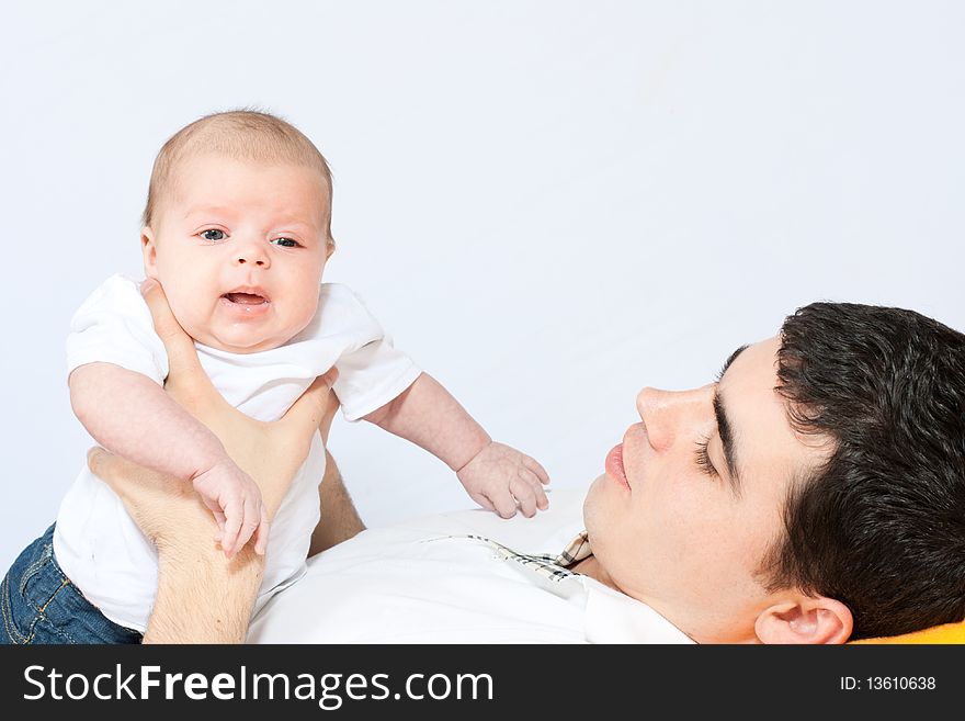 Happy family home: father playing with his little baby. Happy family home: father playing with his little baby