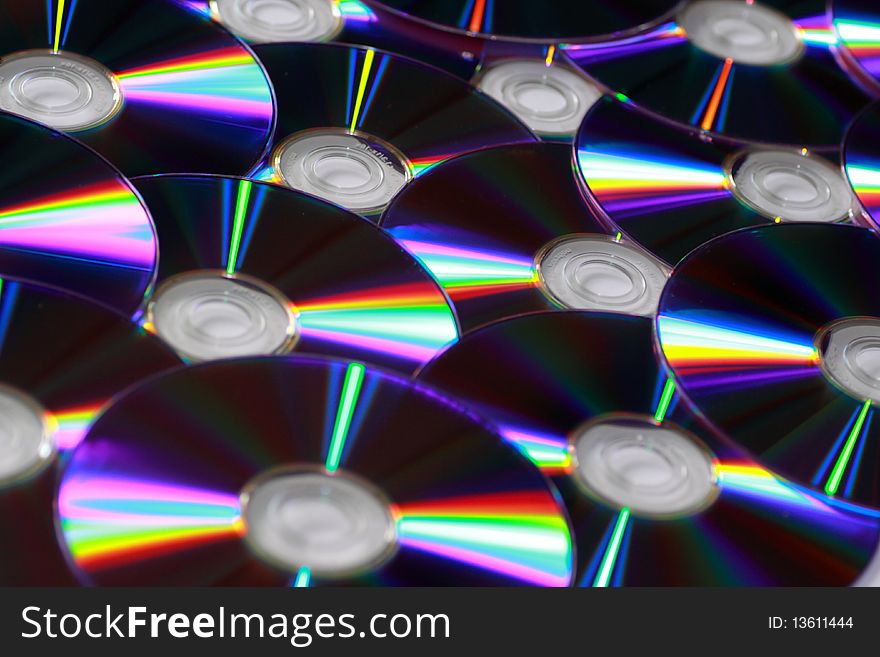 A photograph of dvd and cd. A photograph of dvd and cd