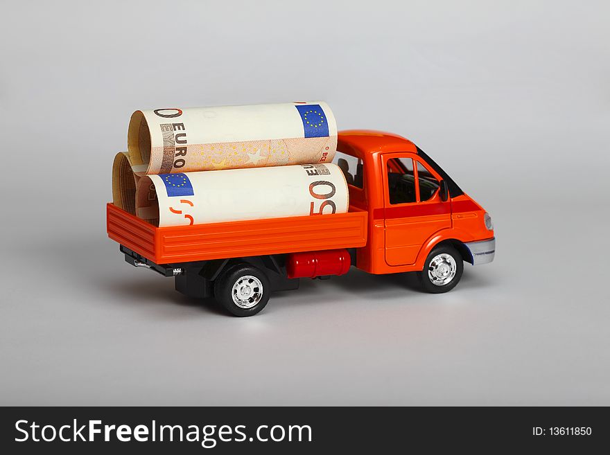 Red lorry with euro bank-papers.