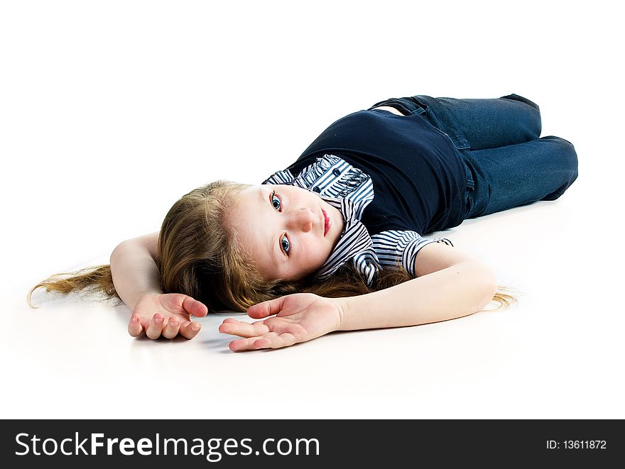 Beautiful little girl lie. Isolated on a white background. Beautiful little girl lie. Isolated on a white background
