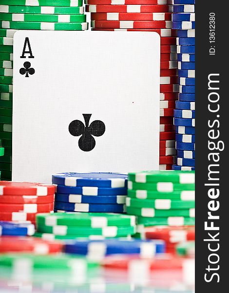 Poker card, one ace with lots of greeen, red and blue chips. Poker card, one ace with lots of greeen, red and blue chips