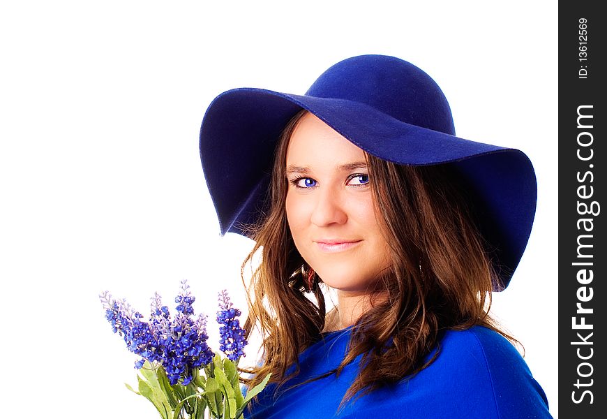 Beautiful woman in hat holding lavender flower over white background