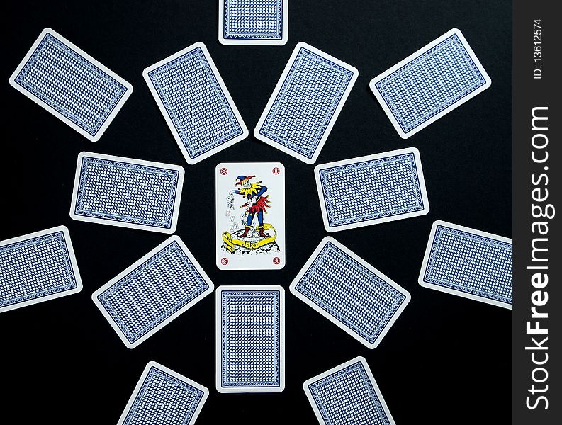 Playing cards on the black background