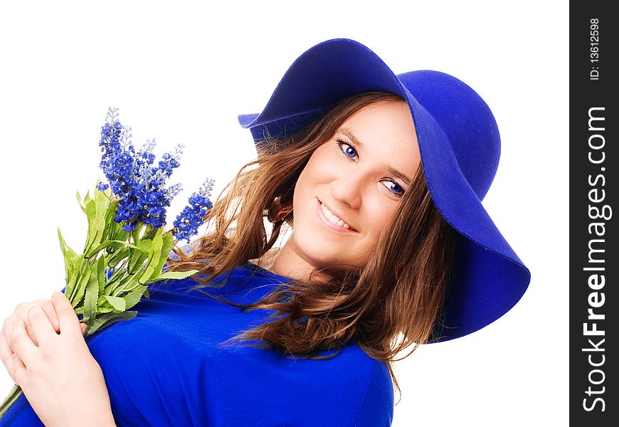 Beautiful woman in hat holding lavender flower over white background