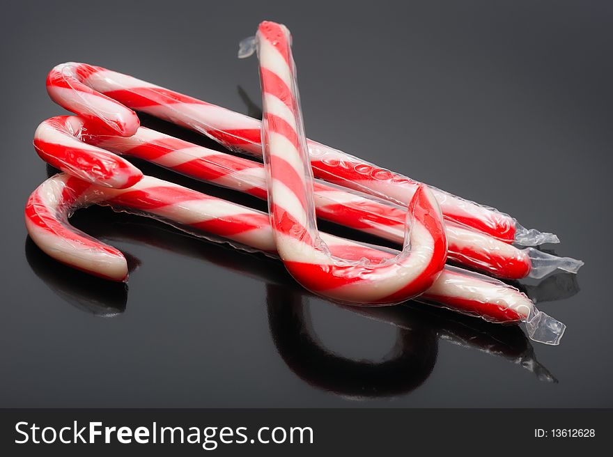 Striped christmas candy on a black background
