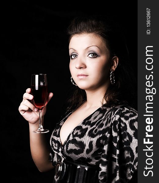 Elegant Woman Holding Wine Over Dark
