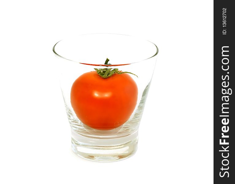 Fresh Tomato In Glass Isolated On White