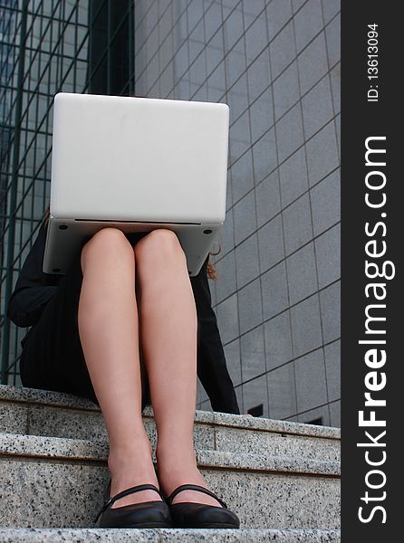 Business woman. Legs and a laptop. Business woman. Legs and a laptop.