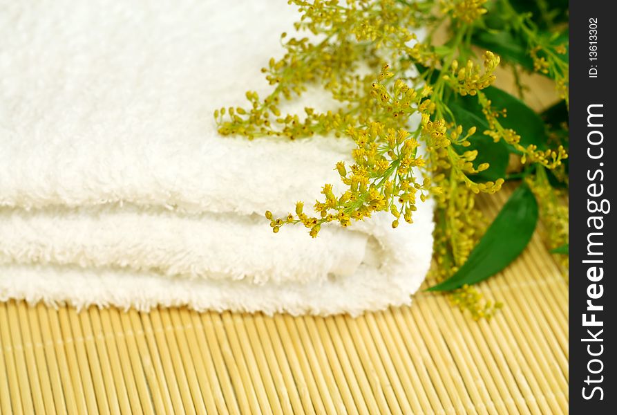 Spa Composition Of Towel And Flowers